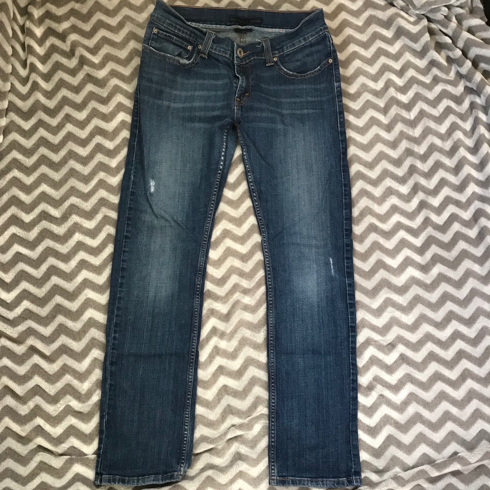 Levi’s 542 distressed pencil jeans